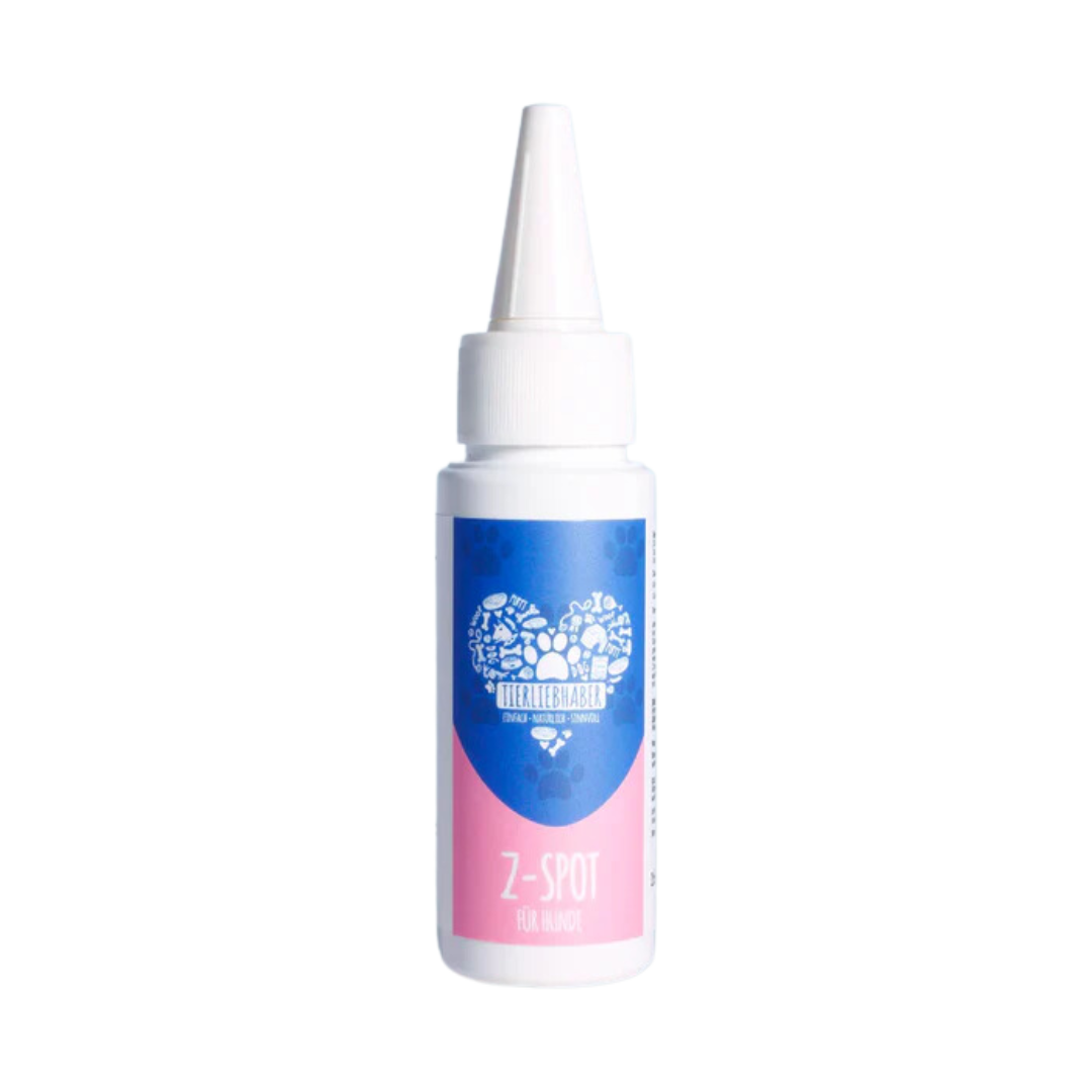 Weiße Kunststoffflasche mit spitzem Verschluss, blau-rosa Etikett mit Text 'Tierliebhaber', 'Z-Spot für Hunde', 50 ml