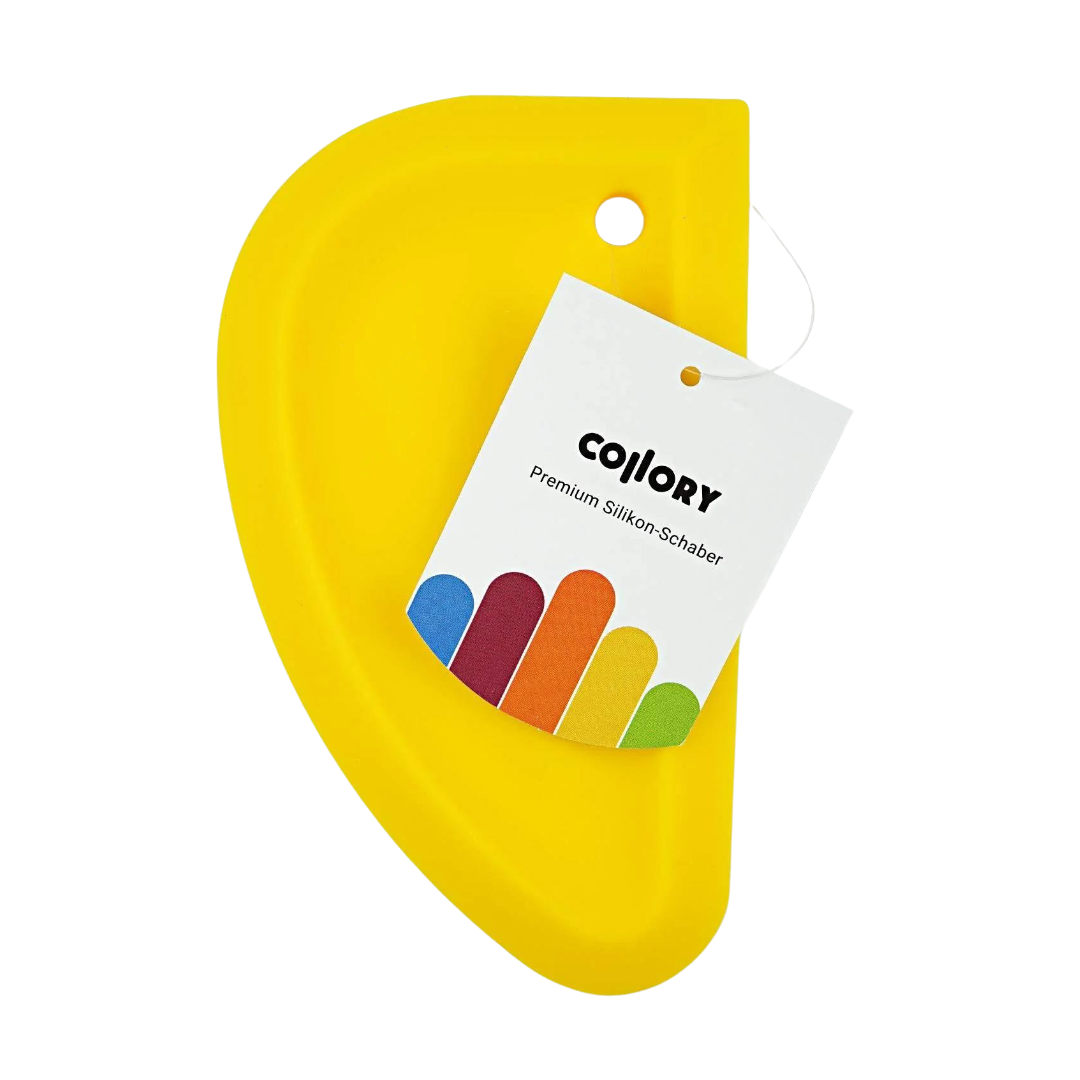 Gelber Silikonschaber in halbrunder Form mit Anhänger aus Papier mit dem Text 'COLLORY Premium Silikon-Schaber'.