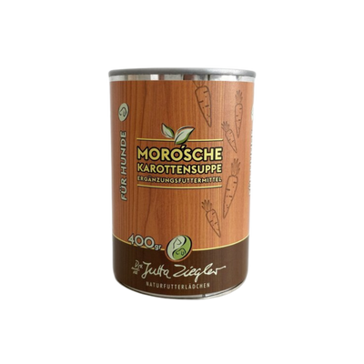 Dose mit Karottensuppe für Hunde. Auf der Vorderseite steht 'MORO'sche Karottensuppe', '400 gr' und 'Ergänzungsfuttermittel'. Dekorative Karottenmuster sind abgebildet.