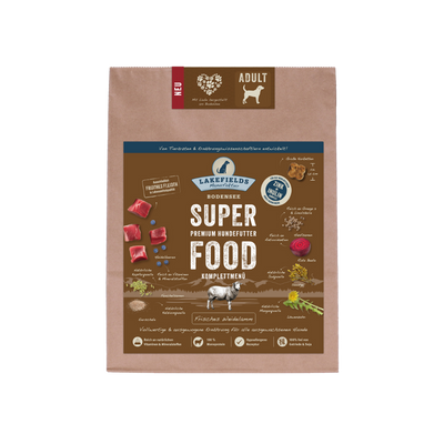Verpackung von Lakefields Superfood für Hunde, 1 kg. BrauneTüte mit Bildern von Weidelamm, Kräutern und dem Text 'NEU' und 'Adult'.