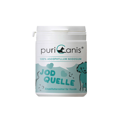 Weiß-grüne Dose mit der Aufschrift 'puriCanis', 'ERLESENE GARTENKRÄUTER', 'KÜCHENHELDEN' und 'Ergänzungsfuttermittel für Hunde', mit Zeichnung eines stehenden Hundes und Kräutern.