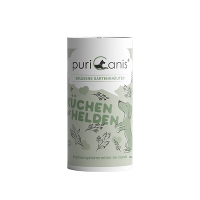 Weiß-grüne Dose mit der Aufschrift 'puriCanis', 'ERLESENE GARTENKRÄUTER', 'KÜCHENHELDEN' und 'Ergänzungsfuttermittel für Hunde', mit Zeichnung eines stehenden Hundes und Kräutern.