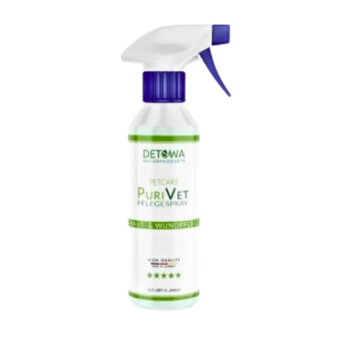 Weißes Sprühflasche mit blauem Sprühkopf, beschriftet mit 'Detowa Naturprodukte', 'PuriVet Pflegespray', 'Haut & Wundpflege' und fünf Sternen.
