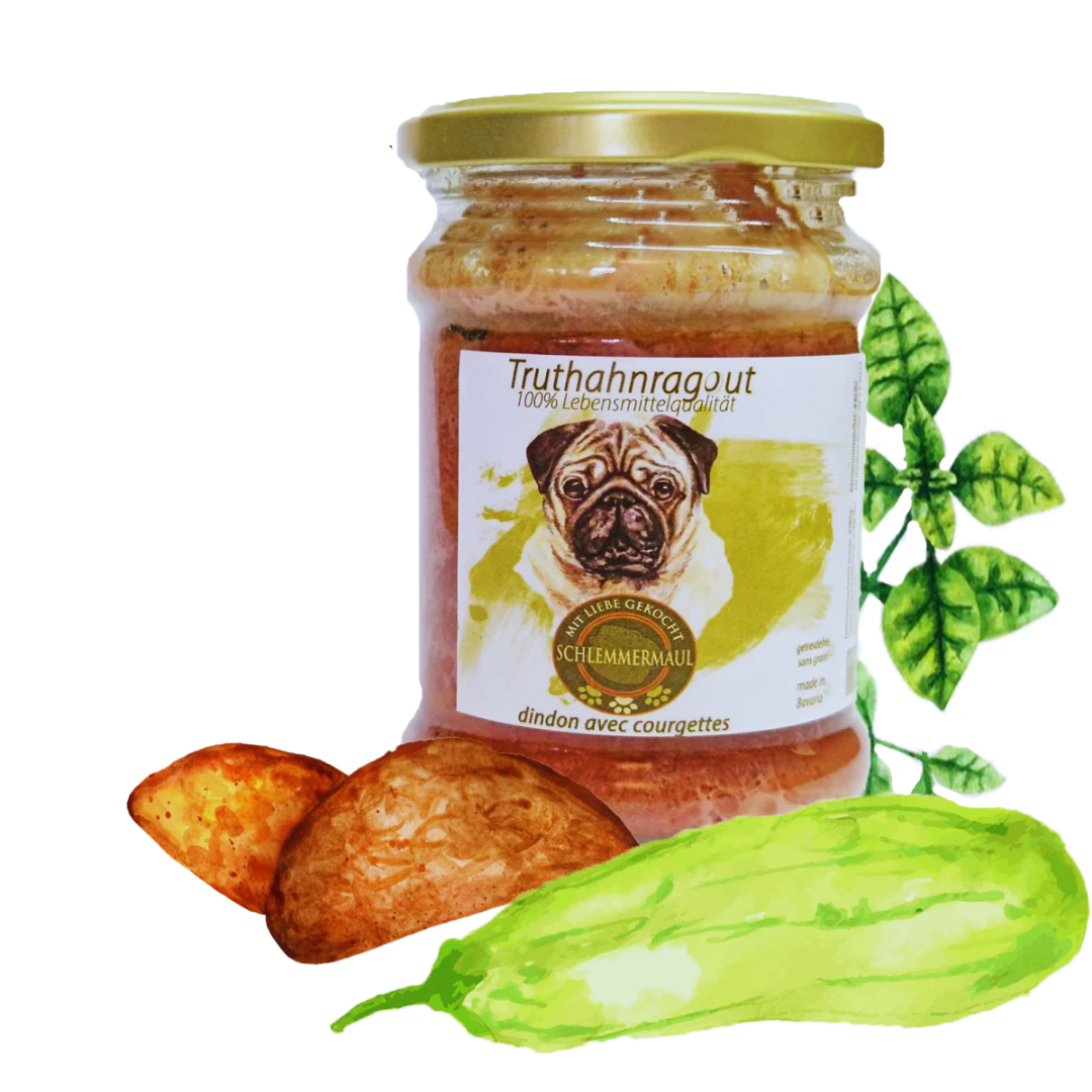 Glas mit goldfarbenem Deckel, Etikett zeigt Mops und Text 'Truthahnragut 100% Lebensmittelqualität', daneben zwei Kartoffeln, eine Gurke und grüne Blätter.
