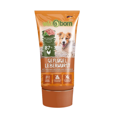 Braune Tube Wildborn Geflügel Leberwurst mit Bild eines Hundes, Text zu 87% frischem Geflügel, ohne Zucker und getreidefrei.