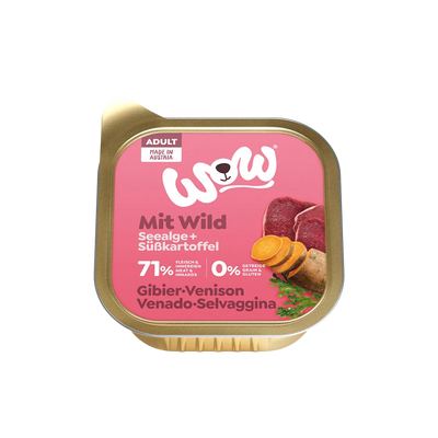 Goldfarbene Verpackung mit Aufschrift 'WOW Dog Wild Adult', Bild von Wildfilets und Kräutern, 71 % Fleisch und Innereien, ohne Getreide, hergestellt in Österreich.