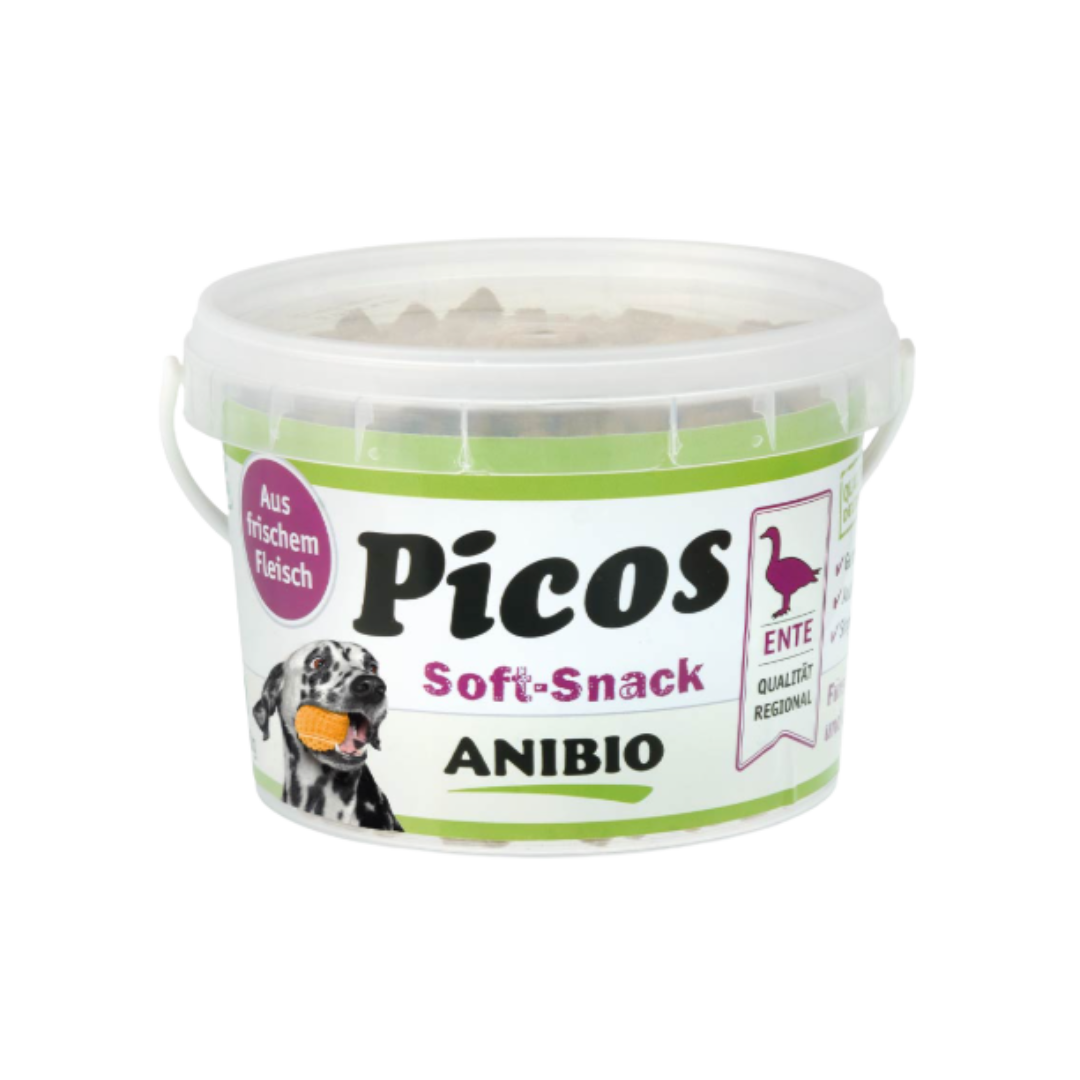 Dose mit Deckel, beschriftet mit 'Picos Soft-Snack', Marke 'ANIBIO', enthält Entenfleisch, abgebildet mit einem Hund und einem Entensymbol.
