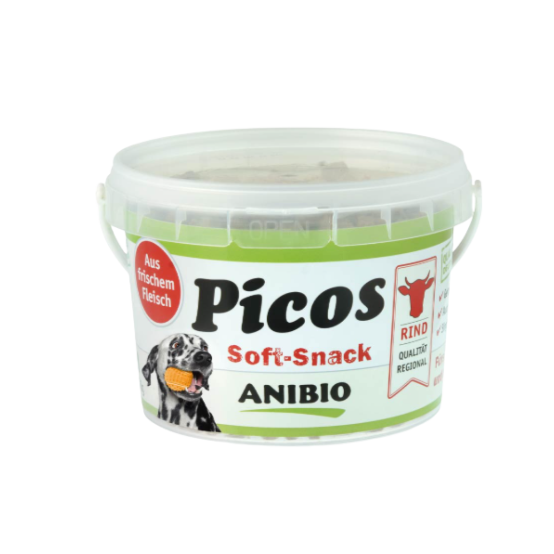 Dose mit Deckel, beschriftet mit 'Picos Soft-Snack', Marke 'ANIBIO', enthält Rindfleisch, abgebildet mit einem Hund und einem Rindsymbol.