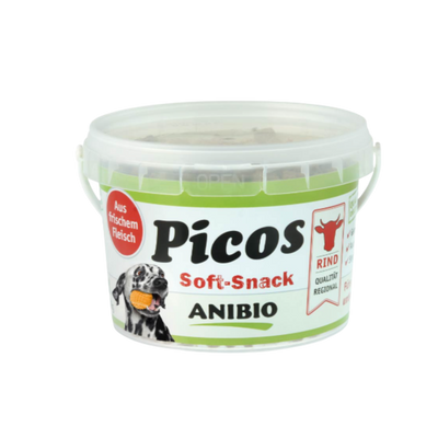 Dose mit Deckel, beschriftet mit 'Picos Soft-Snack', Marke 'ANIBIO', enthält Rindfleisch, abgebildet mit einem Hund und einem Rindsymbol.