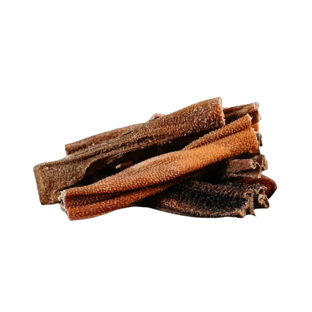 Getrocknete Lammpansen von Barfgold, gestapelt in einer unregelmäßigen Form, braune und orangefarbene Textur.