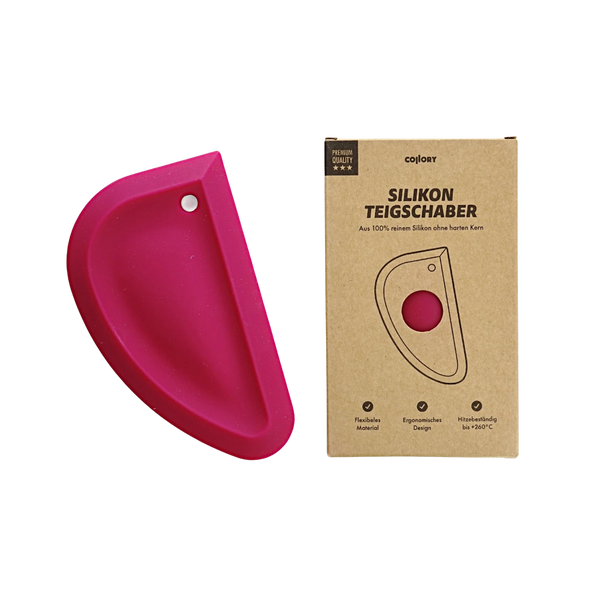 Rosa Silikon-Teigschaber in halbrunder Form neben einer braunen Verpackung mit dem Text 'SILIKON TEIGSCHABER'.