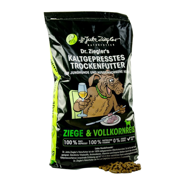 Schwarze Verpackung von Dr. Ziegler's kaltgepresstem Trockenfutter für Hunde mit Illustration eines Hundes, der an einem Tisch sitzt und Wein trinkt, Text 'Ziege & Vollkornreis' und Futterstückchen daneben.