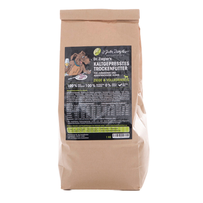 Braune Papiertüte mit schwarzem Etikett für Dr. Ziegler's kaltgepresstes Trockenfutter für Junghunde und ausgewachsene Hunde, Ziege & Vollkornreis, 1 kg.