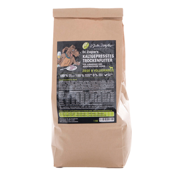 Braune Papiertüte mit schwarzem Etikett für Dr. Ziegler's kaltgepresstes Trockenfutter für Junghunde und ausgewachsene Hunde, Ziege & Vollkornreis, 1 kg.