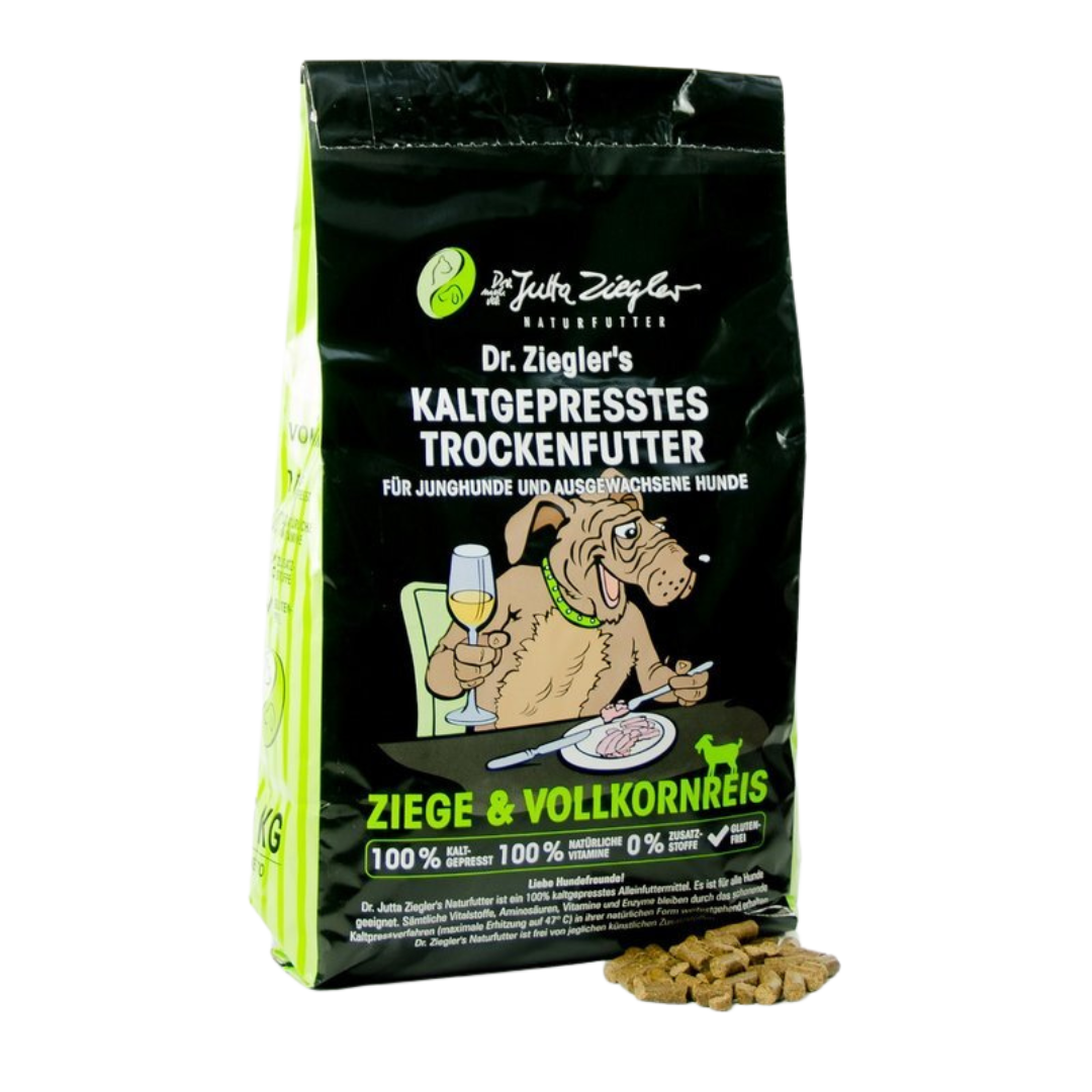 Schwarze Verpackung von Dr. Ziegler's kaltgepresstem Trockenfutter für Hunde mit Illustration eines Hundes, der an einem Tisch sitzt und Wein trinkt, Text 'Ziege & Vollkornreis' und Futterstückchen daneben.