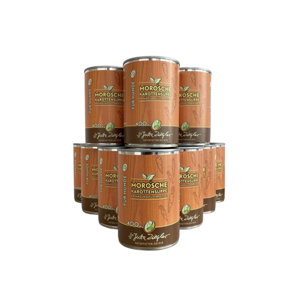 12 Dose mit Karottensuppe für Hunde. Auf der Vorderseite steht 'MORO'sche Karottensuppe', '400 gr' und 'Ergänzungsfuttermittel'. Dekorative Karottenmuster sind abgebildet.