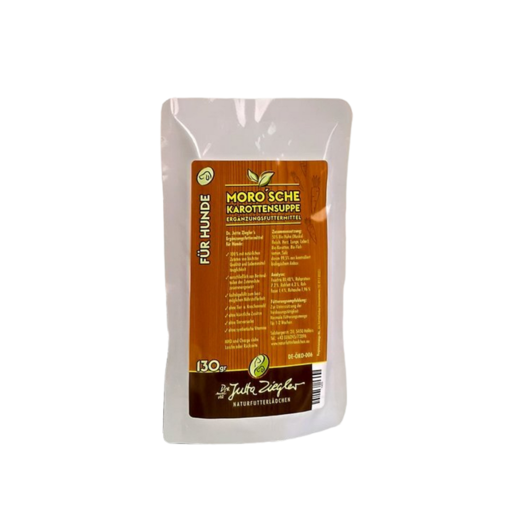 Verpackung von 'Moro'sche Karottensuppe für Hunde', 130 g. Braune Vorderseite mit grünen und weißen Elementen, Zutatenliste und Herstellerinformationen.