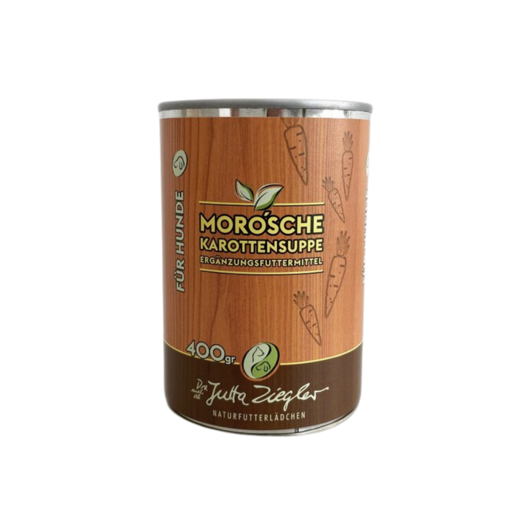 Dose mit Karottensuppe für Hunde. Auf der Vorderseite steht 'MORO'sche Karottensuppe', '400 gr' und 'Ergänzungsfuttermittel'. Dekorative Karottenmuster sind abgebildet.