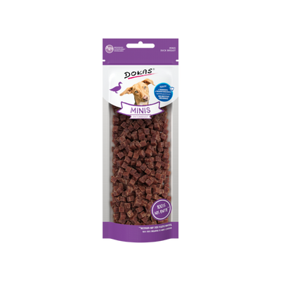 Verpackung von 'DOKAS MINIS' mit einem Hund auf dem Etikett. Die Tüte enthält kleine, würfelförmige Snacks aus Entenfleisch.