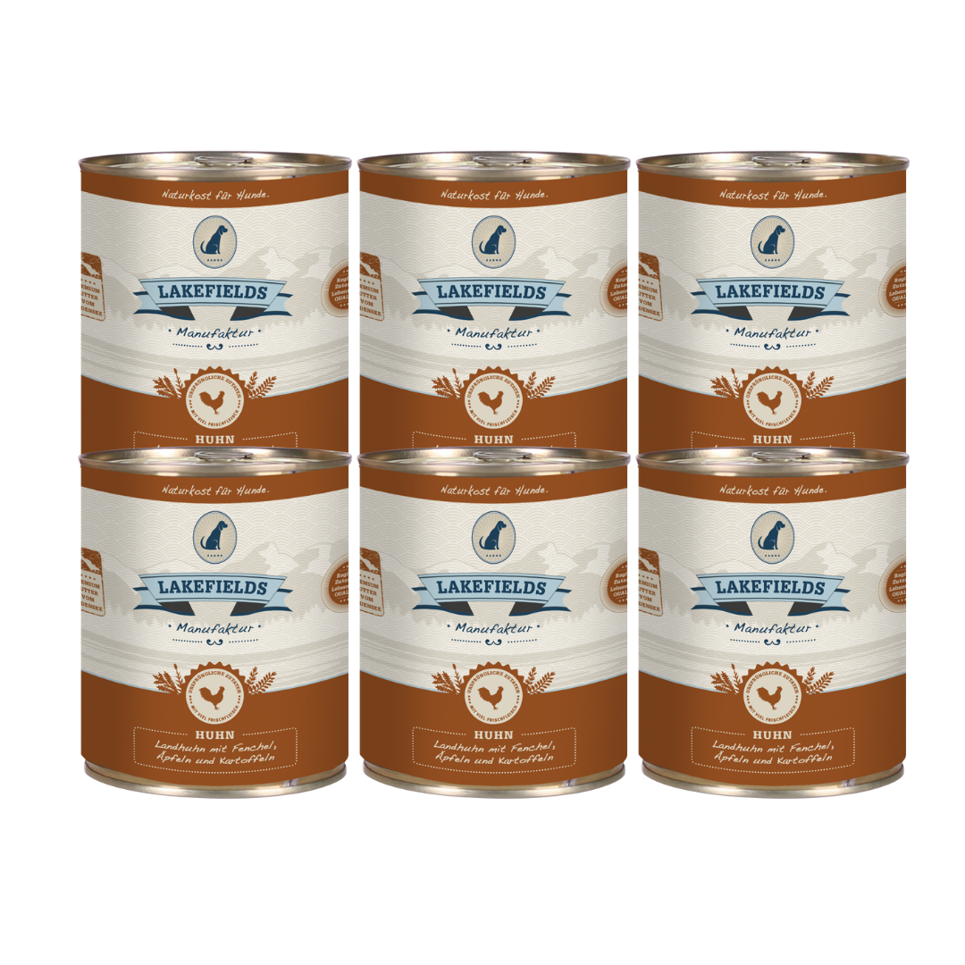 Sechs Runde Dosen mit dem Etikett 'LAKEFIELDS', Inhalt: Landhuhn mit Fenchel, Äpfeln und Kartoffeln. Die Dose hat einen metallischen Glanz und eine braune Farbfläche.