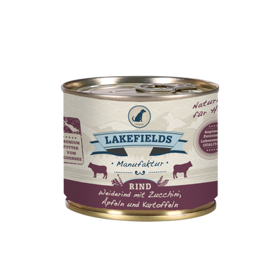 Runde Dose mit dem Etikett 'LAKEFIELDS', Inhalt: Weiderind mit Zucchini, Äpfelnund Kartoffeln. Die Dose hat einen metallischen Glanz und violetter Farbfläche.