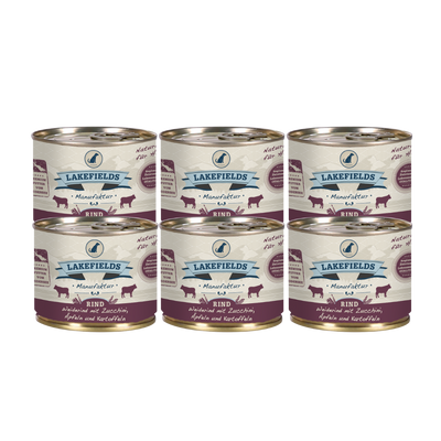 Sechs Runde Dosen mit dem Etikett 'LAKEFIELDS', Inhalt: Weiderind mit Zucchini, Äpfelnund Kartoffeln. Die Dose hat einen metallischen Glanz und violetter Farbfläche.