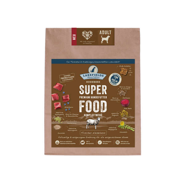 Verpackung von Lakefields Superfood für Hunde, 1 kg. BrauneTüte mit Bildern von Weidelamm, Kräutern und dem Text 'NEU' und 'Adult'.
