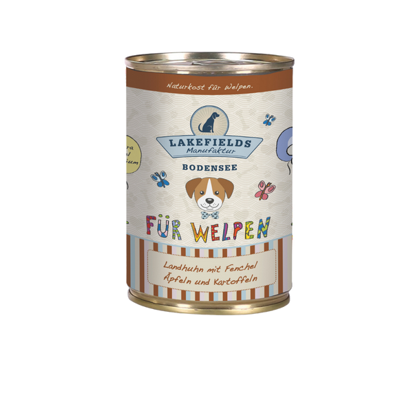 Runde Dose mit Hundefutter von Lakefields, 400g. Auf dem Etikett steht 'BODENSEE FÜR WELPEN', mit Abbildungen von Hunden, Blumen und Texten.