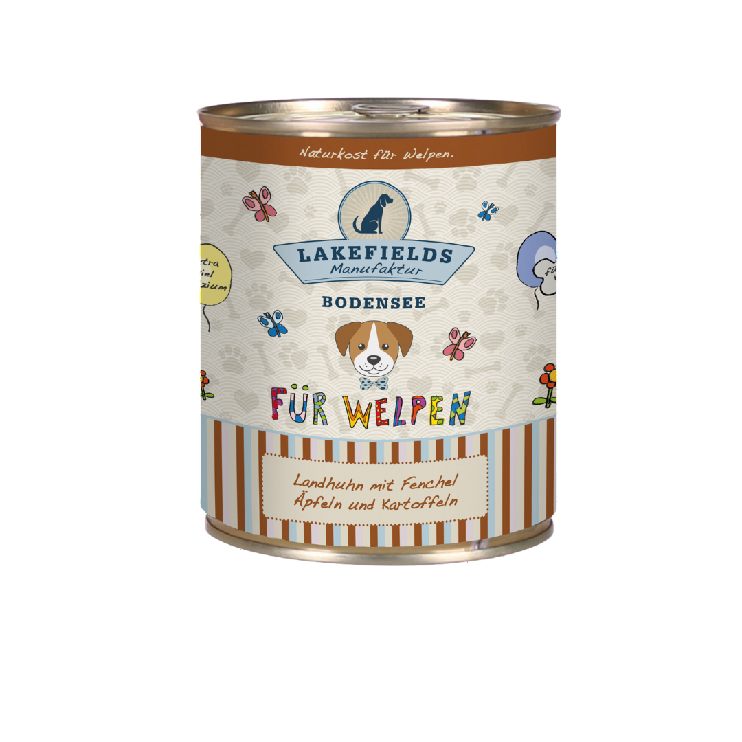 Runde Dose mit Hundefutter von Lakefields, 800g. Auf dem Etikett steht 'BODENSEE FÜR WELPEN', mit Abbildungen von Hunden, Blumen und Texten.