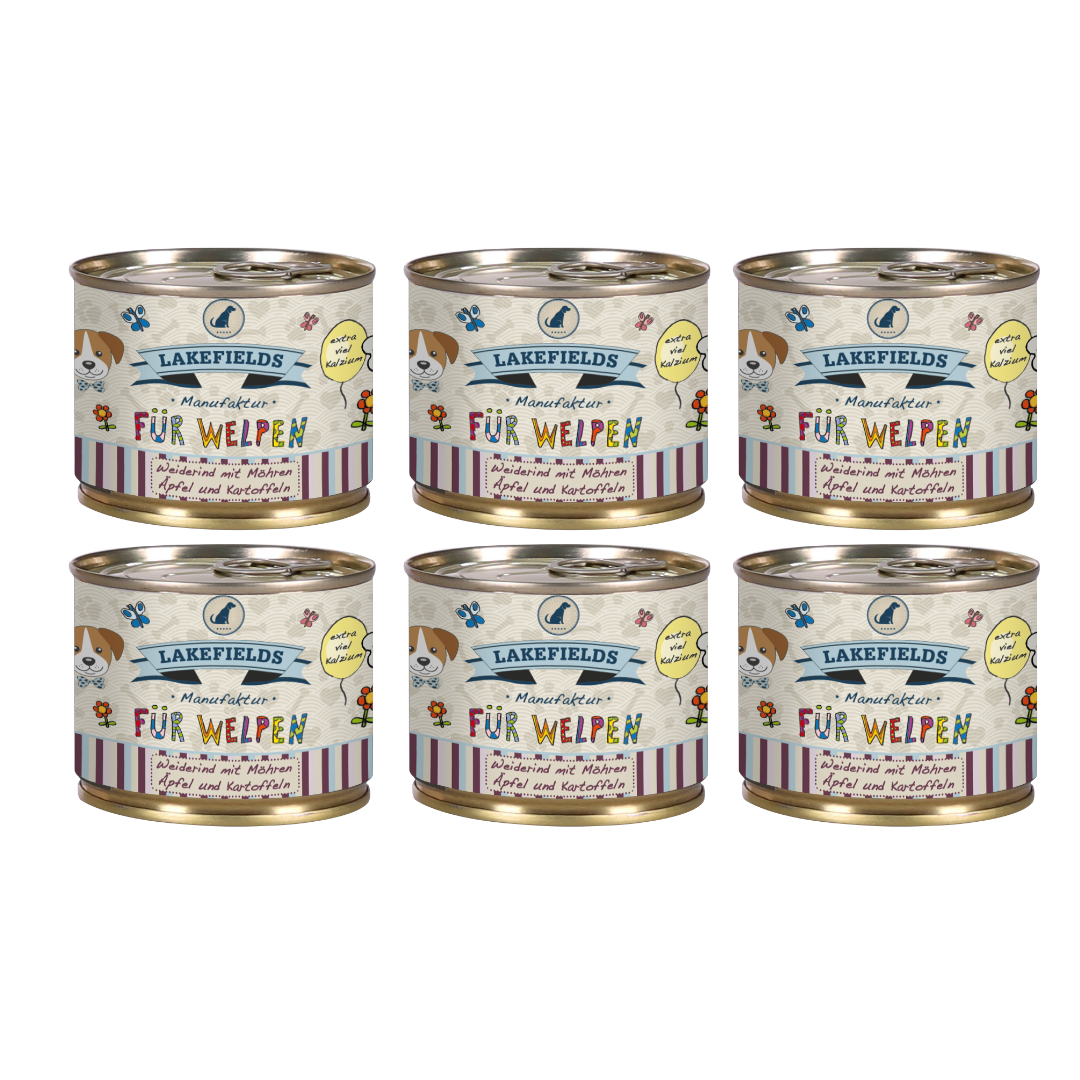 Sechs runde Dosen mit Hundefutter von Lakefields, 200g. Auf dem Etikett steht 'BODENSEE FÜR WELPEN', mit Abbildungen von Hunden, Blumen und Texten.