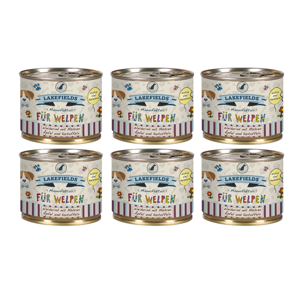 Sechs runde Dosen mit Hundefutter von Lakefields, 200g. Auf dem Etikett steht 'BODENSEE FÜR WELPEN', mit Abbildungen von Hunden, Blumen und Texten.