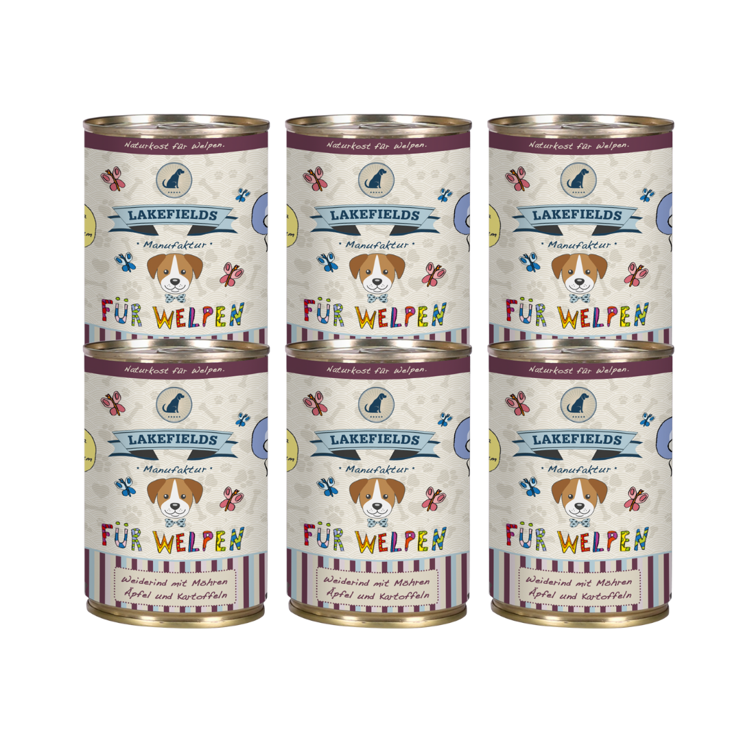 Sechs runde Dosen mit Hundefutter von Lakefields, 400g. Auf dem Etikett steht 'BODENSEE FÜR WELPEN', mit Abbildungen von Hunden, Blumen und Texten.
