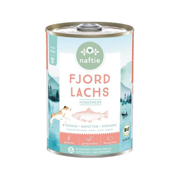 Runddose mit dem Produktnamen 'FJORD LACHS' von naftie. Enthält Quinoa, Karotten und Oregano. Abgebildet sind ein Hund und eine Landschaft mit Bergen und Wasser.