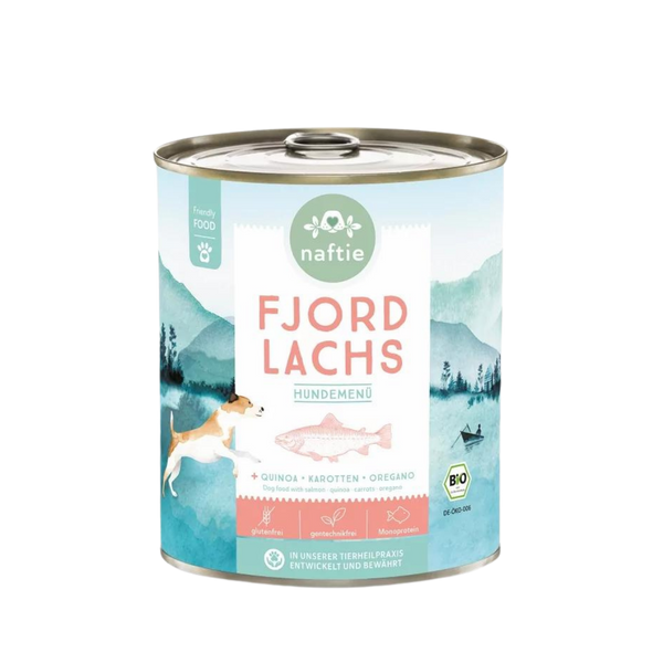 Runddose mit dem Produktnamen 'FJORD LACHS' von naftie. Enthält Quinoa, Karotten und Oregano. Abgebildet sind ein Hund und eine Landschaft mit Bergen und Wasser.