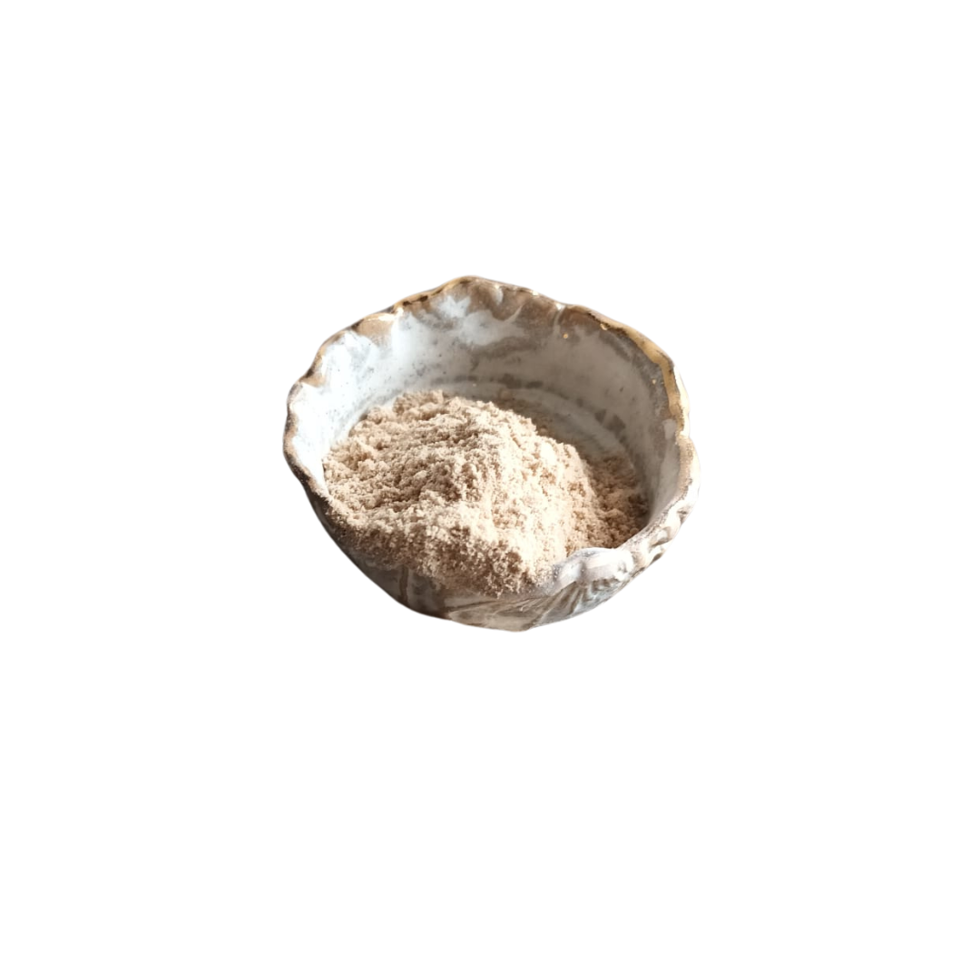 Schale aus Keramik mit unregelmäßigem Rand und goldfarbener Verzierung, gefüllt mit feinem, hellbraunem Pulver.