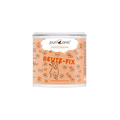 Runde Dose mit Aufschrift 'puriCanis ESSENTIELLE NÄHRSTOFFE BEUTE-FIX' und Illustration eines sitzenden Hundes auf orangefarbenem Hintergrund
