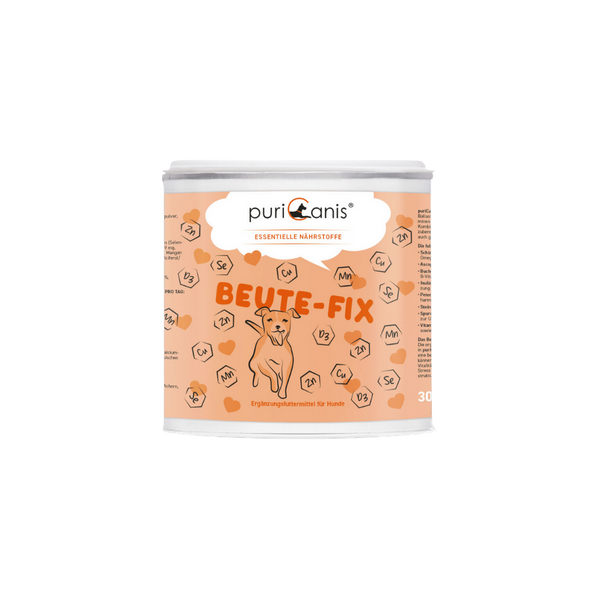 Runde Dose mit Aufschrift 'puriCanis ESSENTIELLE NÄHRSTOFFE BEUTE-FIX' und Illustration eines sitzenden Hundes auf orangefarbenem Hintergrund