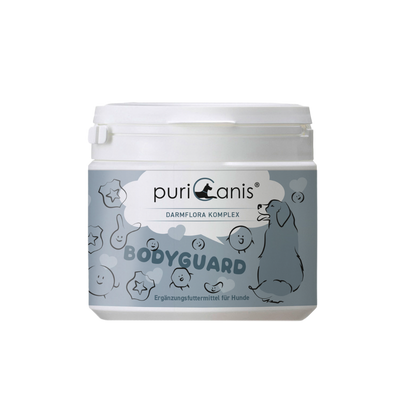 Weißer Behälter mit Aufschrift 'puriCanis DARMFLORA KOMPLEX BODYGUARD Ergänzungsfuttermittel für Hunde' und Zeichnung eines sitzenden Hundes sowie verschiedener lachender und lächelnder Gesichter und Sterne