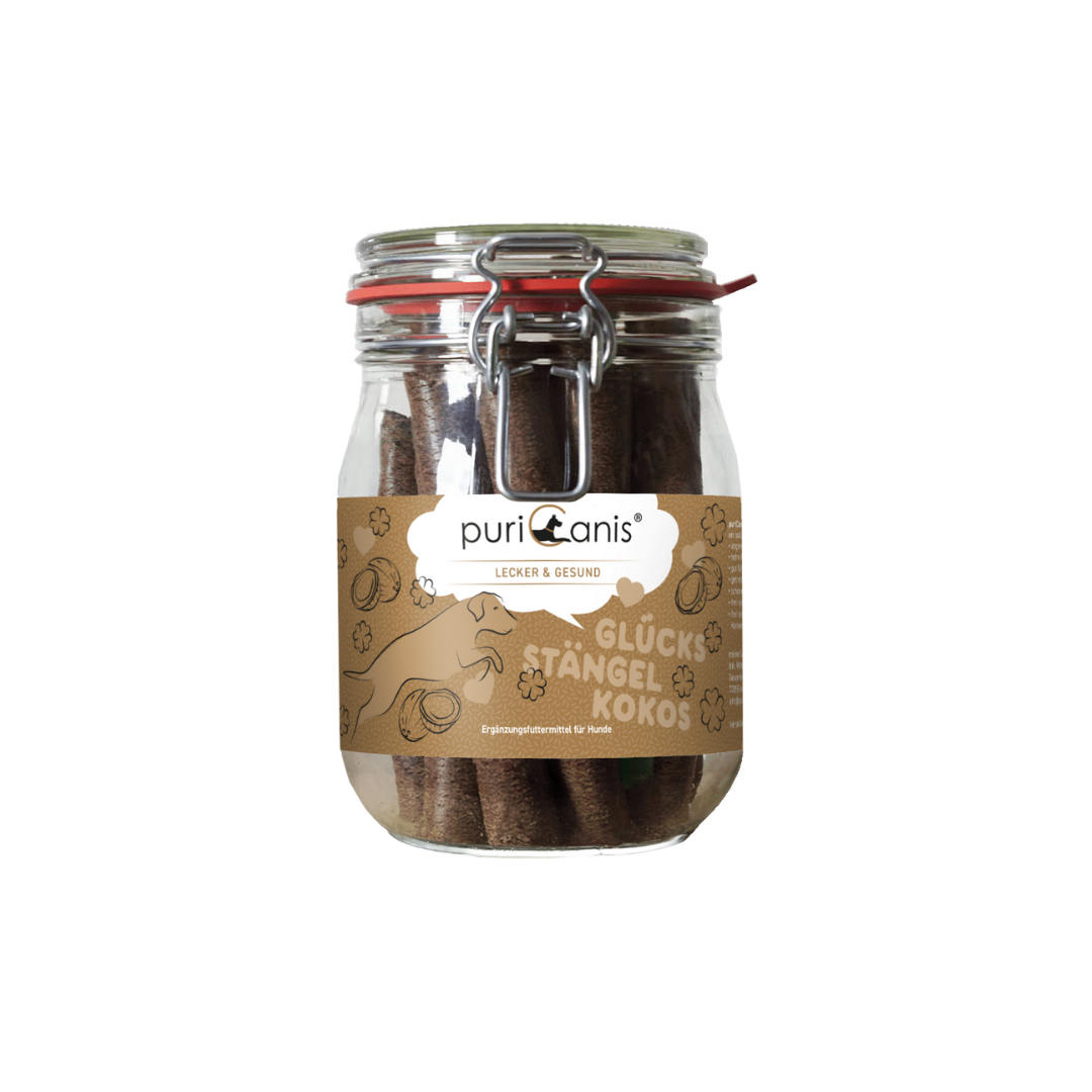 Glas mit braunen Hundekau-Stängeln und braunem Etikett mit der Aufschrift 'puriCanis LECKER & GESUND GLÜCKS STÄNGEL KOKOS'