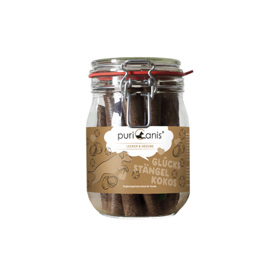 Glas mit braunen Hundekau-Stängeln und braunem Etikett mit der Aufschrift 'puriCanis LECKER & GESUND GLÜCKS STÄNGEL KOKOS'