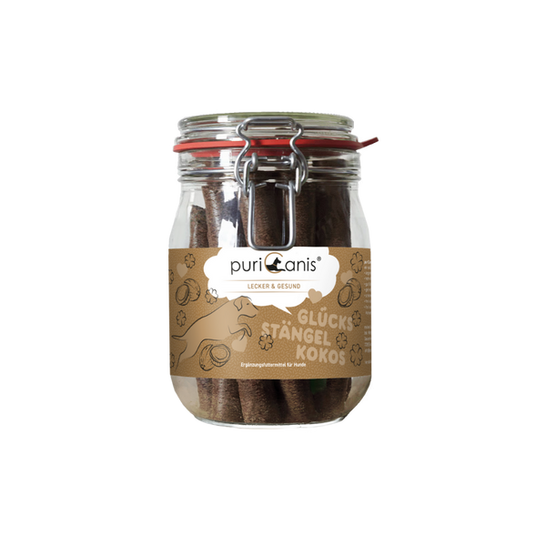 Glas mit braunen Hundekau-Stängeln und braunem Etikett mit der Aufschrift 'puriCanis LECKER & GESUND GLÜCKS STÄNGEL KOKOS'