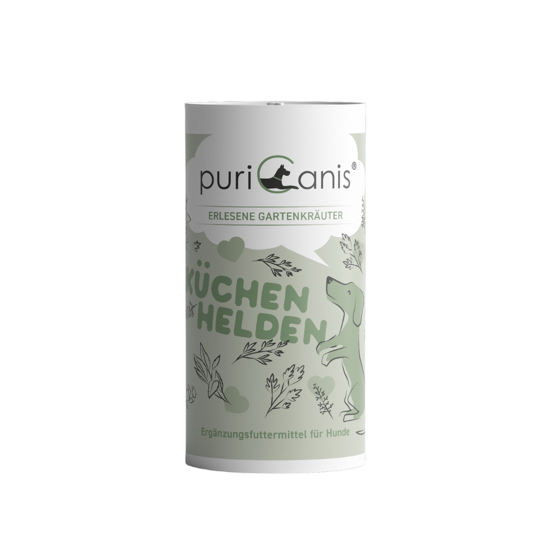 Weiß-grüne Dose mit der Aufschrift 'puriCanis', 'ERLESENE GARTENKRÄUTER', 'KÜCHENHELDEN' und 'Ergänzungsfuttermittel für Hunde', mit Zeichnung eines stehenden Hundes und Kräutern.