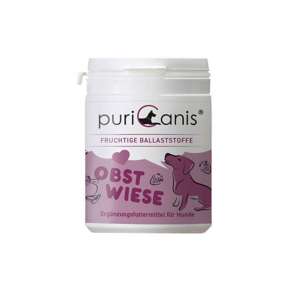 Weißer Behälter mit Aufschrift 'puriCanis', darunter 'Fruchtige Ballaststoffe', 'Obstwiese' und 'Ergänzungsfuttermittel für Hunde', mit lila Hund und Früchten als Grafik.