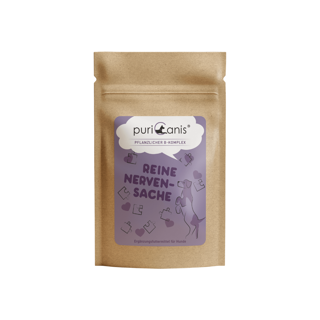 Braune Verpackung mit lila Etikett der Marke puriCanis, pflanzlicher B-Komplex, Text 'Reine Nervensache', Hund und Puzzleteile als Grafik, Ergänzungsfuttermittel für Hunde