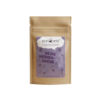 Braune Verpackung mit lila Etikett der Marke puriCanis, pflanzlicher B-Komplex, Text 'Reine Nervensache', Hund und Puzzleteile als Grafik, Ergänzungsfuttermittel für Hunde