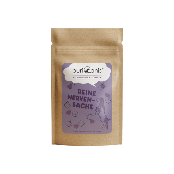 Braune Verpackung mit lila Etikett der Marke puriCanis, pflanzlicher B-Komplex, Text 'Reine Nervensache', Hund und Puzzleteile als Grafik, Ergänzungsfuttermittel für Hunde