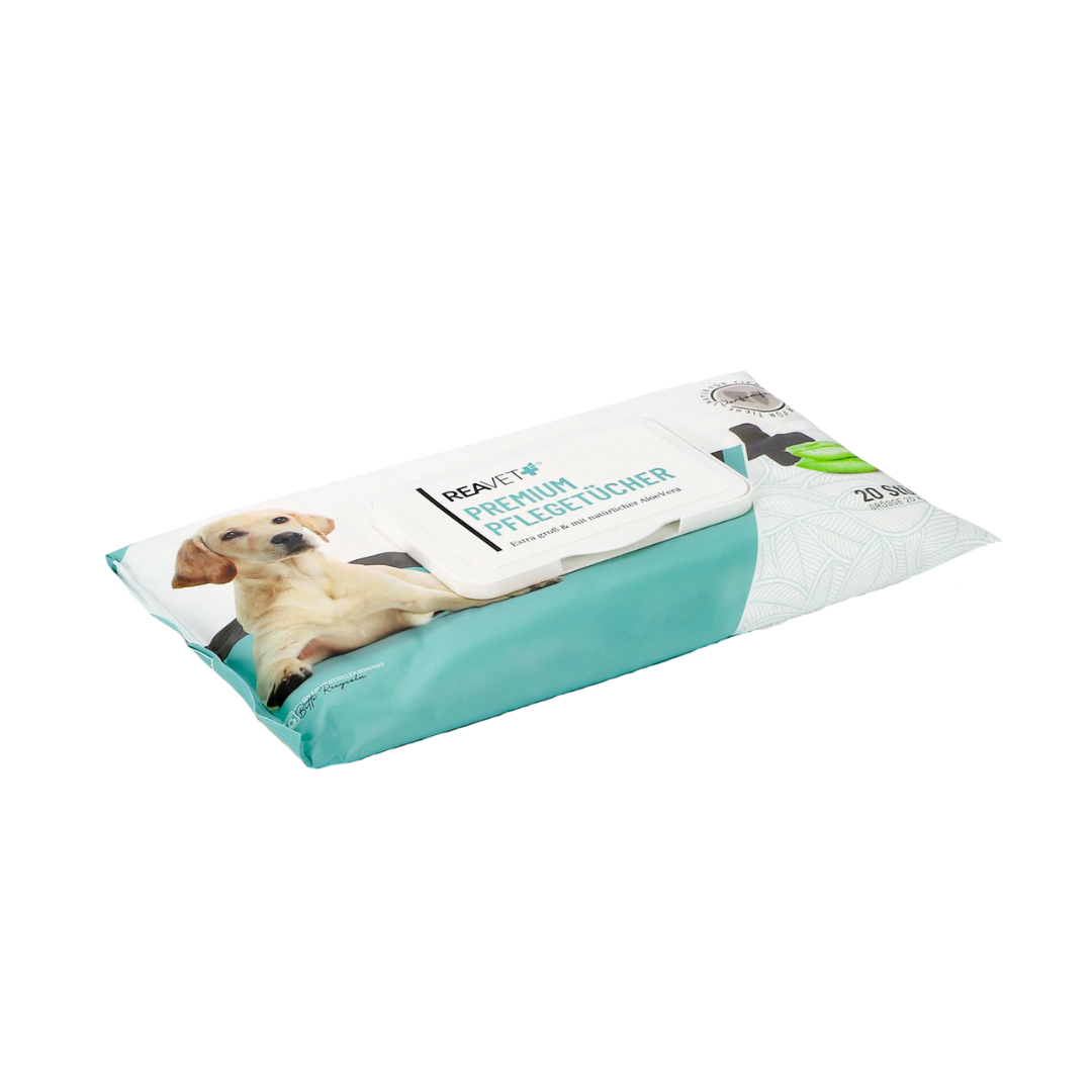 Verpackung von Reavet Premium Pflegetüchern mit Bild eines liegenden Hundes und grünem Blätterdesign.