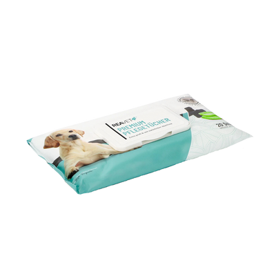 Verpackung von Reavet Premium Pflegetüchern mit Bild eines liegenden Hundes und grünem Blätterdesign.