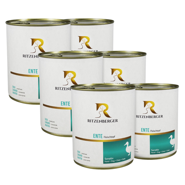 Sechs weiße Dosen mit goldfarbenem Deckel, Marke Ritzenberger, Aufschrift 'ENTE Fleischtopf' und stilisierte weiße Entensilhouette auf türkisfarbenem Feld.