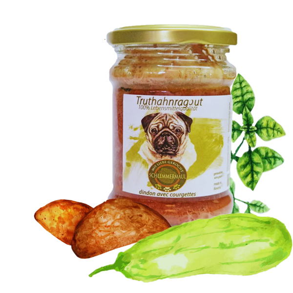 Glas mit goldfarbenem Deckel, Etikett zeigt Mops und Text 'Truthahnragut 100% Lebensmittelqualität', daneben zwei Kartoffeln, eine Gurke und grüne Blätter.